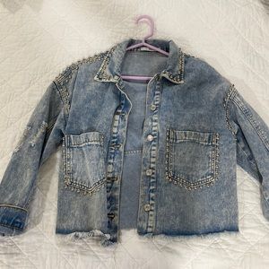 Distressed, studded denim jacket